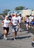  Chuck's niece Sarah with boyfriend Dennis heading to finish line of Memorial Day race they dedicated to Chuck.  