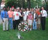  Chuck's nephew Michael Margiotta (White baseball hat), with Delta Tau brothers, past and present, placing wreath at tree dedicated at Brown University for Chuck and other lost Delts.  (9-11-03)