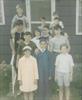  Here is an early pic of some of our neighborhood friends.  Charlie Mangione (the graduate), sent me this pic.  Paul is to the left with someone on his shoulders.  Chuck is in the navy & white tank top.  I am in the center back.  1969